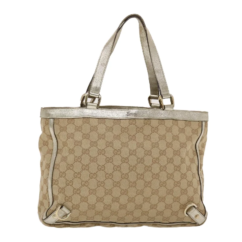 Women Gucci bags with a snap - button closure and a decorative charmGUCCI GG Canvas Tote Bag Beige Gold  49062