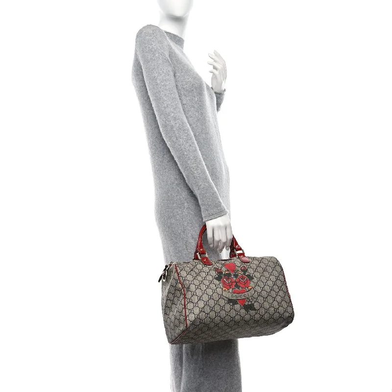 Women Gucci crossbody bags with a woven leather strapGucci Gg Plus Tattoo Heart Medium Joy